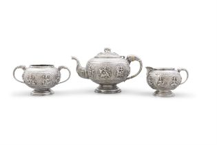 AN ANGLO-INDIAN WHITE METAL TEASET, comprising teapot, sugar bowl and milk jug. 33.7 troy oz (3)