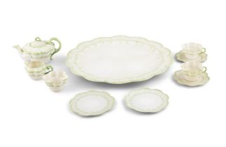 A BELLEEK SECOND PERIOD ERNE PATTERN PART TEA SERVICE decorated with green paint foliate sprays,