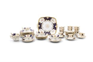 A COALPORT CHINA TEA AND COFFEE SERVICE the white ground decorated with floral sprays with