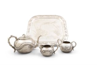 A CHINESE EXPORT 'DRAGON' TEA SET, EARLY 20TH CENTURY comprising a tea pot, sugar bowl and
