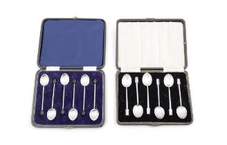 TWO CASED SETS OF NOVELTY SILVER COFFEE SPOONS, comprising six with coffee bean handles,