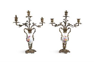 A PAIR OF FRENCH 19TH CENTURY ORMOLU AND PORCELAIN CANDLEABRA, the white ground urns with hand