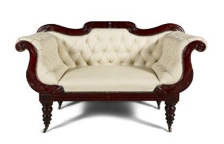 A GEORGE IV MAHOGANY FRAMED SCROLL END BUTTON BACK SETTEE, upholstered in cream leather,