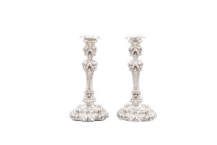 ***WITHDRAWN*** A PAIR OF 19TH CENTURY WHITE METAL DESK CANDLESTICKS profusely decorated with