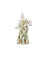 A DULEVO RUSSIAN PORCELAIN FIGURE OF A DANCER, dressed in a headscarf and dress painted with