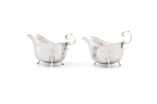 A PAIR OF SILVER SAUCE BOATS Birmingham, c.1913 mark of ES Barnsley & Co., with wavy rims on