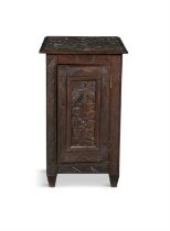 AN AFRICAN CARVED HARDWOOD CABINET, MID 20TH CENTURY, of squared upright form decorated to the