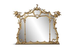 A GILTWOOD AND GESSO COMPARTMENTAL OVERMANTEL MIRROR, in the rococo taste, flanked with ho-ho