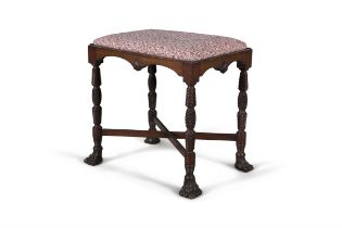 A MAHOGANY PIANO STOOL the frieze centred by a shell within beaded borders, on carved legs and