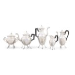 A FRENCH 20TH CENTURY TEA AND COFFEE SERVICE Of white metal and baluster form,