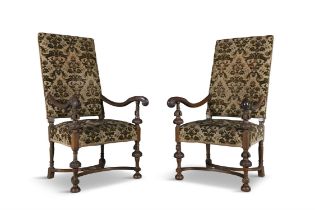 A PAIR OF MAHOGANY FRAMED ARMCHAIRS IN THE JACOBEAN STYLE upholstered back and seats,