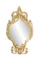 AN EARLY 18TH CENTURY OVAL GILTWOOD GIRANDOLE WALL MIRROR, the beaded frame with outer foliate