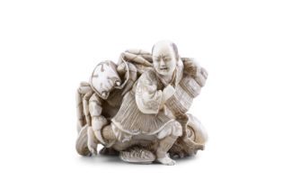 λ A FANTASTIC IVORY OKIMONO Japan, Meiji period (1868-1912) Carved as a grimacing fisherman