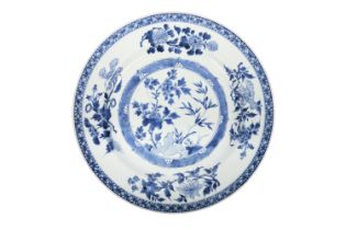 A LARGE BLUE AND WHITE ‘FLOWERS’ CHARGER China, 19th Century of circular shape,