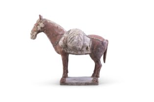 A FINE AND RARE CHINESE PACK HORSE 唐代 彩陶馬 China, Tang dynasty Standing foursquare on a