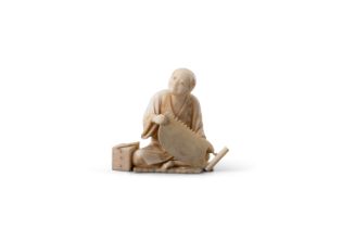 λ AN IVORY OKIMONO OF A CARPENTER Japan, Meiji period (1868-1912) Modelled seated and