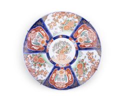 AN IMARI CIRCULAR CHARGER, Japan, Meiji period (1868-1912) centred with a still life flower