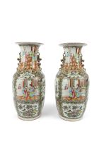 A PAIR OF CANTON PORCELAIN VASES WITH FIGURES AND FLOWERS China, early 20th century H. 43.7cm