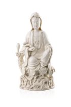 A DEHUA FIGURE OF SEATED GUANYIN 晚清 何朝宗款 德化觀音坐像 China, late Qing dynasty. The depiction