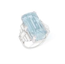 An Aquamarine dress ring The octagonal mixed-cut aquamarine, between two, stepped shoulders,