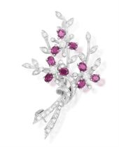 A Diamond and ruby spray brooch Designed as a bouquet, with oval, mixed-cut rubies as petals,