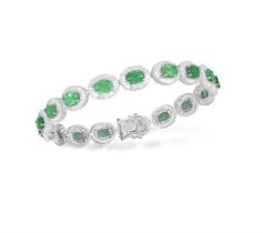 An Emerald and diamond cluster bracelet Composed of seventeen oval-shaped emeralds with tapered
