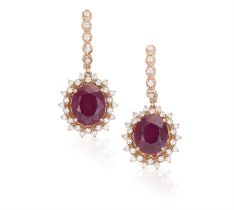 A Pair of synthetic ruby and diamond drop earrings The oval, mixed-cut ruby and round,