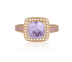 An Amethyst, diamond and pink sapphire cluster ring The cushion-shaped amethyst within a