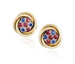 A Pair of ruby and sapphire earrings Each centering a flowerhead motif, set with cushion-shaped