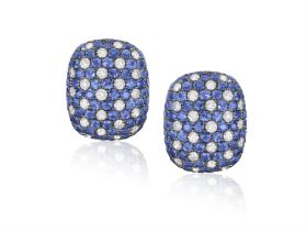 A Pair of sapphire and diamond ear studs The pill-shaped ear studs set alternately with round,