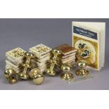 Various assorted fireplace tiles, and four pairs of brass doorknob handles.