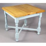 A mid-20th century oak drawer-leaf dining table the pale painted base having four baluster turned