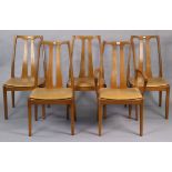 A set of five Nathan teak rail-back dining chairs (including one carver) with padded seats, & on