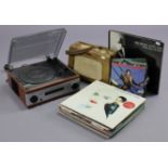 A Dynation portable radio; a Derens turntable/radio; & approximately forty various records.
