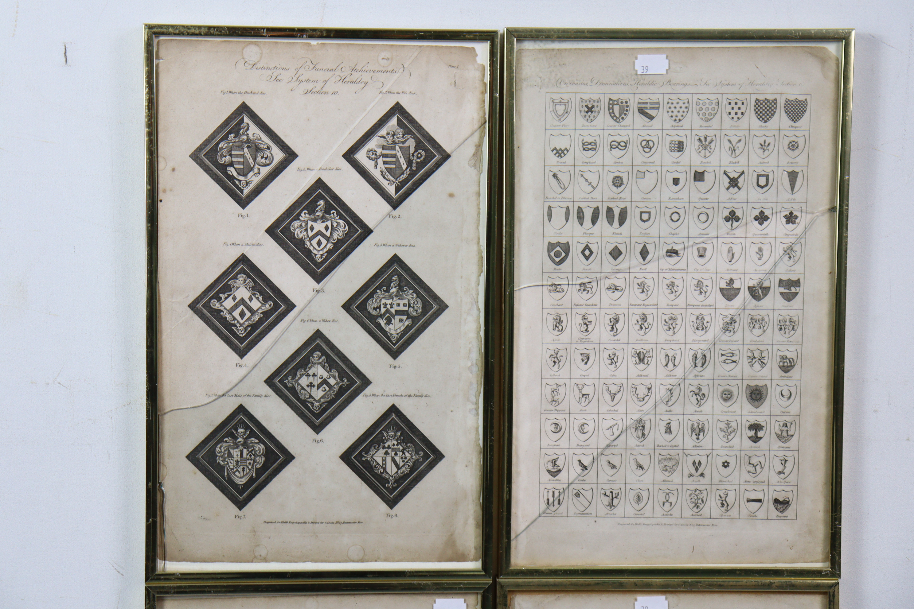Four vintage engravings - all depicting family crests, 15½” x 9½”, in matching glazed frames. - Image 2 of 3