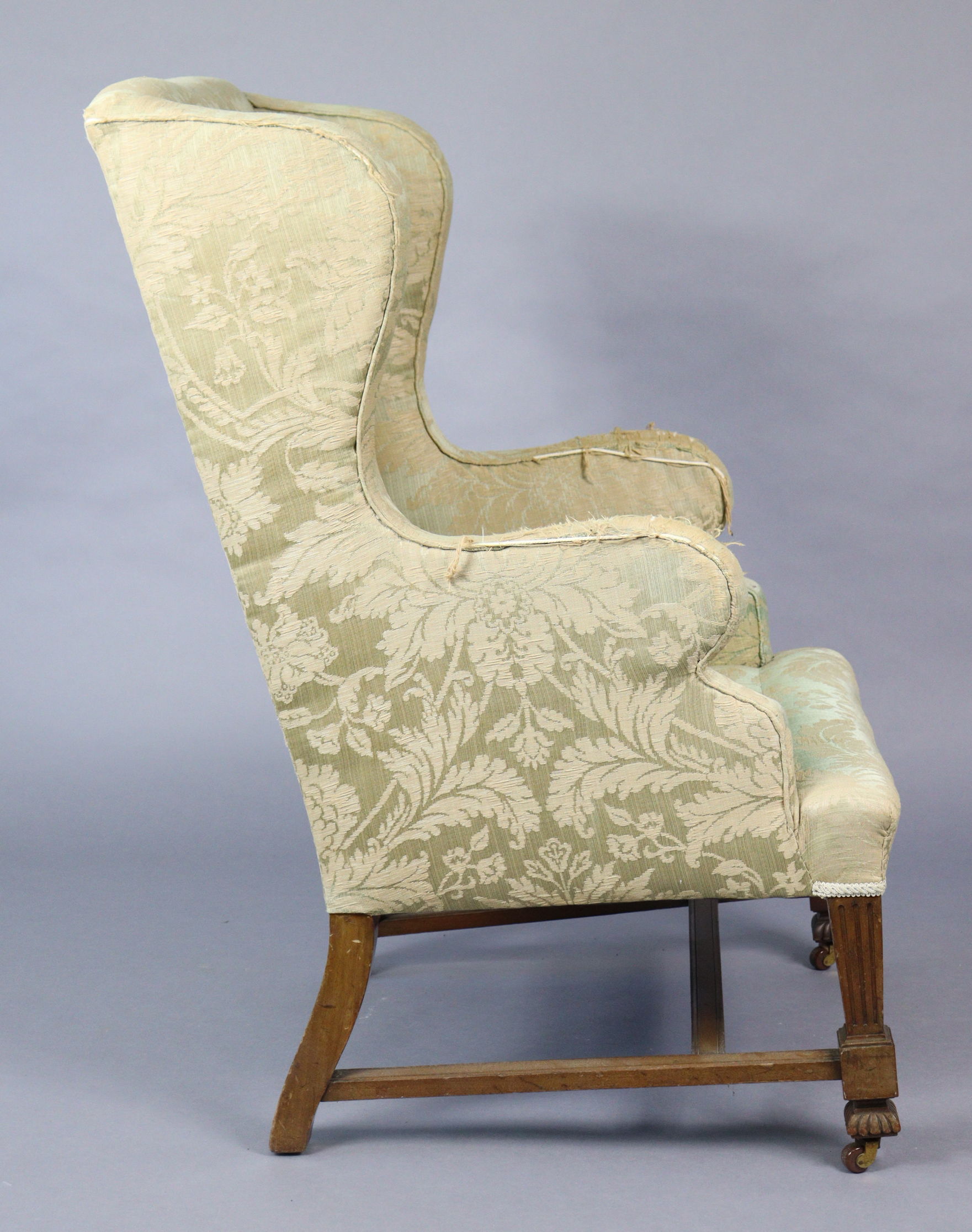 A Late 19th/early 20th century wing-back armchair (requires re-upholstery), on short square fluted - Bild 2 aus 5