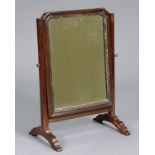 A Georgian mahogany swing toilet glass inset bevelled mirror plate with inner gilt slip, on square