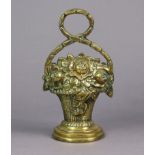 A cast-brass novelty door stop in the form of a basket-of-flowers, & with a ring handle, 12½” high.