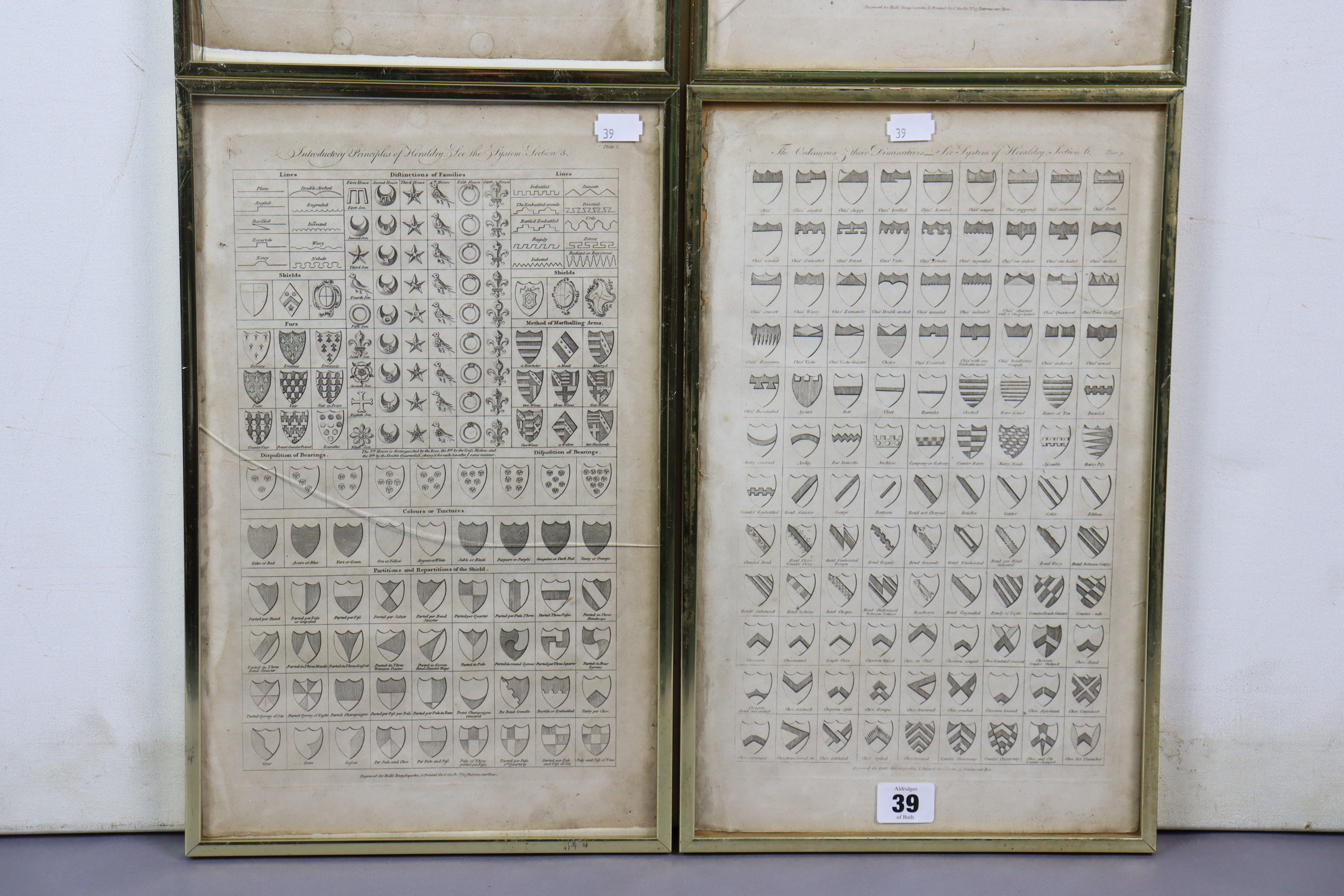 Four vintage engravings - all depicting family crests, 15½” x 9½”, in matching glazed frames. - Image 3 of 3