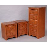 A Silentnight mahogany-finish upright cabinet enclosed by a hinged lift-lid above four long drawers,