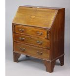 An Edwardian inlaid-mahogany small bureau with a fitted interior enclosed by a fall-front above
