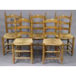 A set of five continental-style ladder-back kitchen chairs with woven-rush seats, & on turned legs