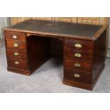 A mid-20th century mahogany pedestal desk inset black leatherette, each pedestal fitted four long