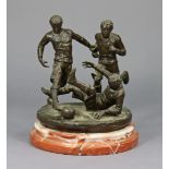 A bronzed metal model of three footballers, on a marble circular base, 14” high.