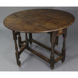 A 17th century oak gate-leg table, fitted frieze drawer to one end, with shaped apron, half-round