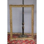 A Chinese-style black, gold and red painted wooden standard lamp (lacking shade) two small rugs