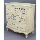 A continental-style cream painted wooden serpentine-front chest fitted three long graduated drawers,