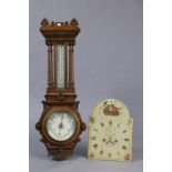 A vintage painted metal longcase clock dial, together with a pair of longcase clock weights, and a