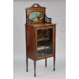 An Edwardian inlaid mahogany side cabinet with raised back inset oval bevelled mirror plate, abo