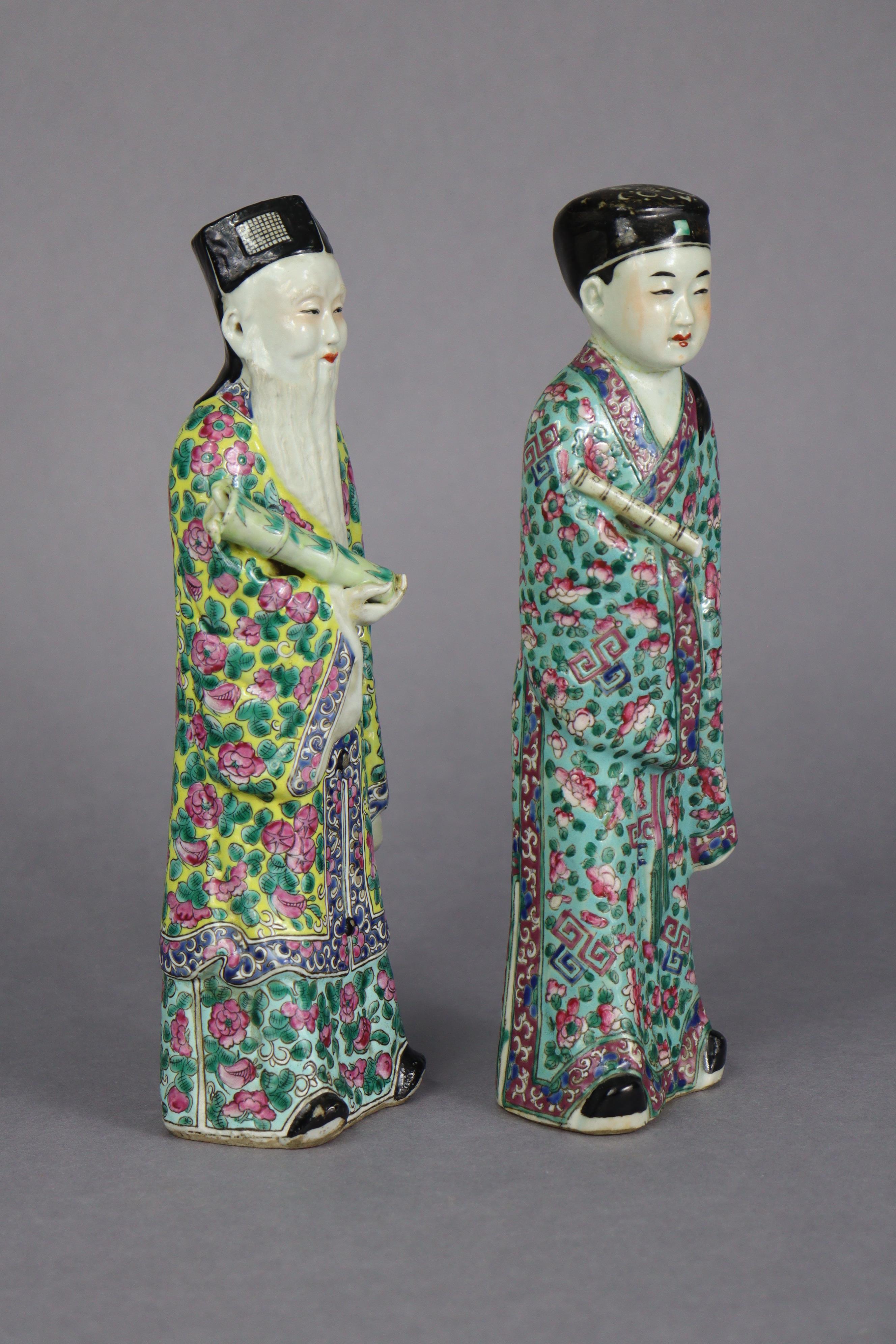 A pair of late 19th/early 20th century Chinese famille rose porcelain standing scholar figures, 10¾” - Image 2 of 4